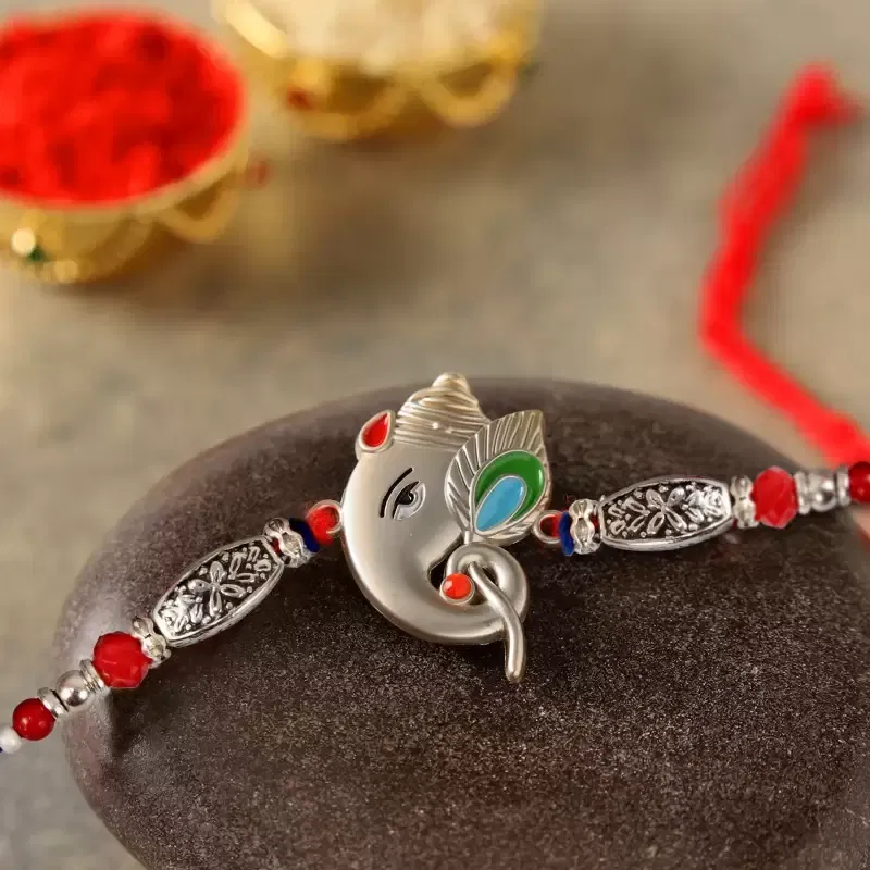 Silver Ganesh Rakhi With Roli & Chawal
