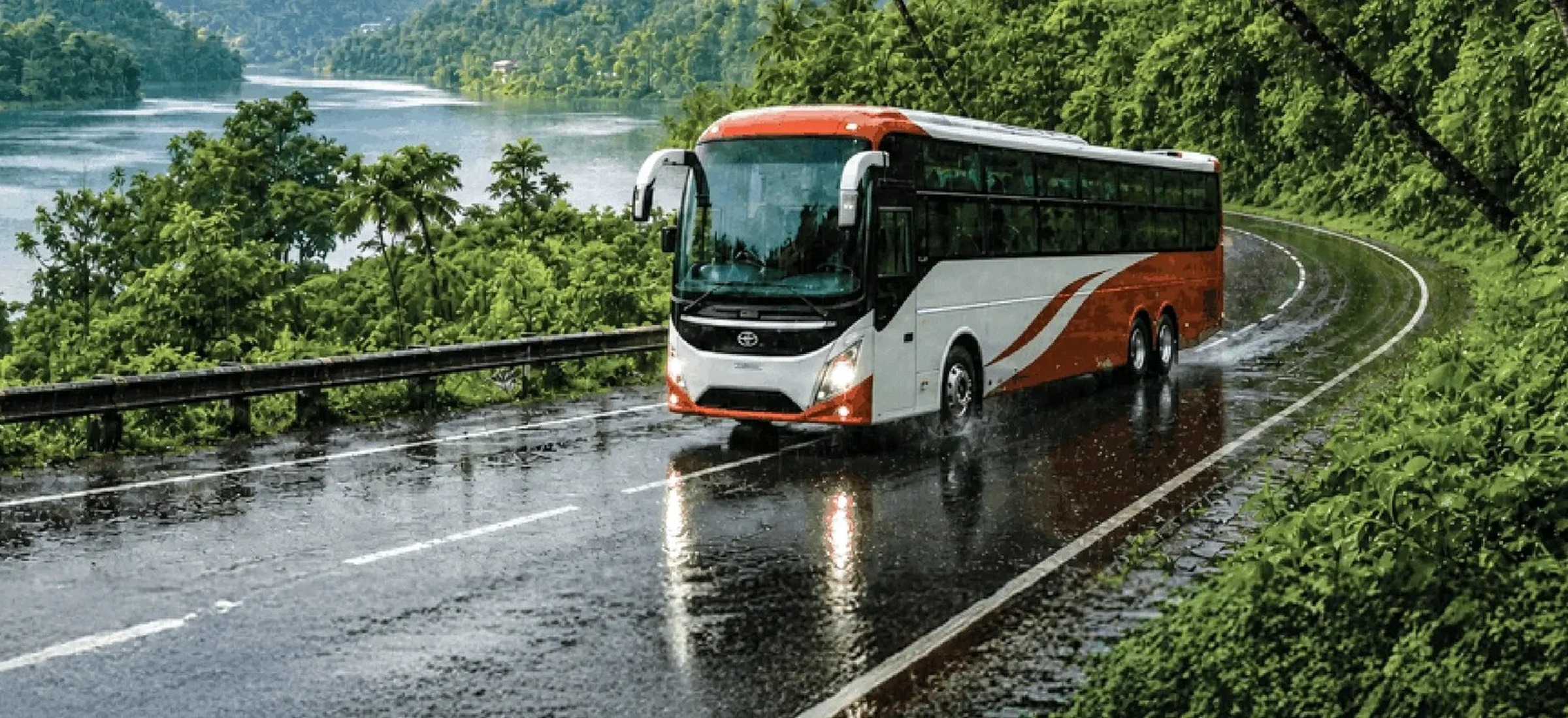 An intercity coach on a wet ghat road beside a river, from AbhiBus's own header photograph, on this page about AbhiBus bus ticket cancellation charges and refund rules