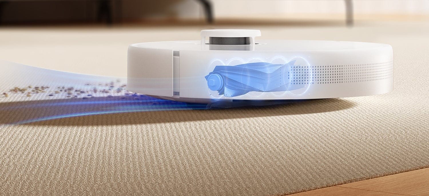 A robot vacuum cleaning a rug in a living room, from DREAME's D10 Plus campaign photography