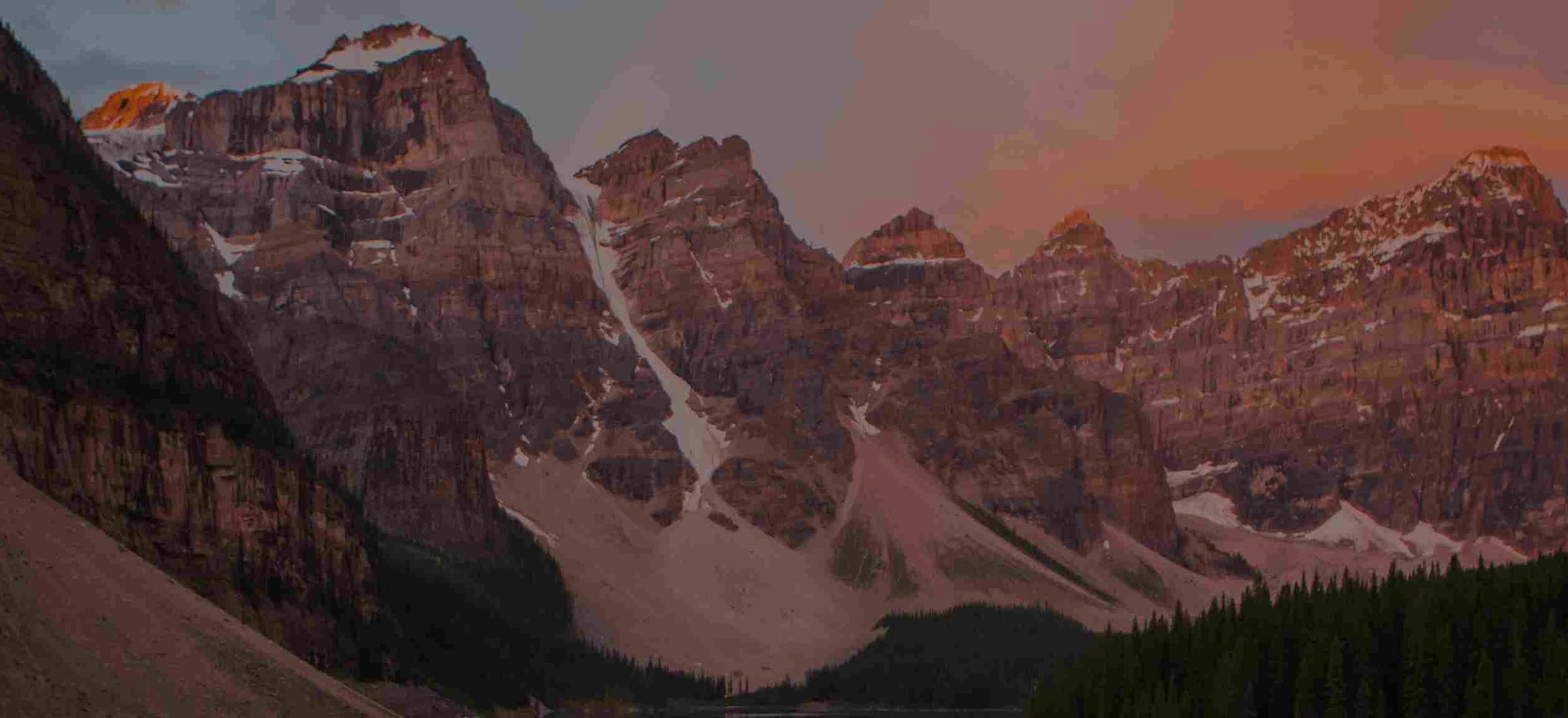 MakeMyTrip's own site photography - a mountain range at dusk above a treeline - heading this read of the 78 travel offers live on MakeMyTrip on 20 August 2026