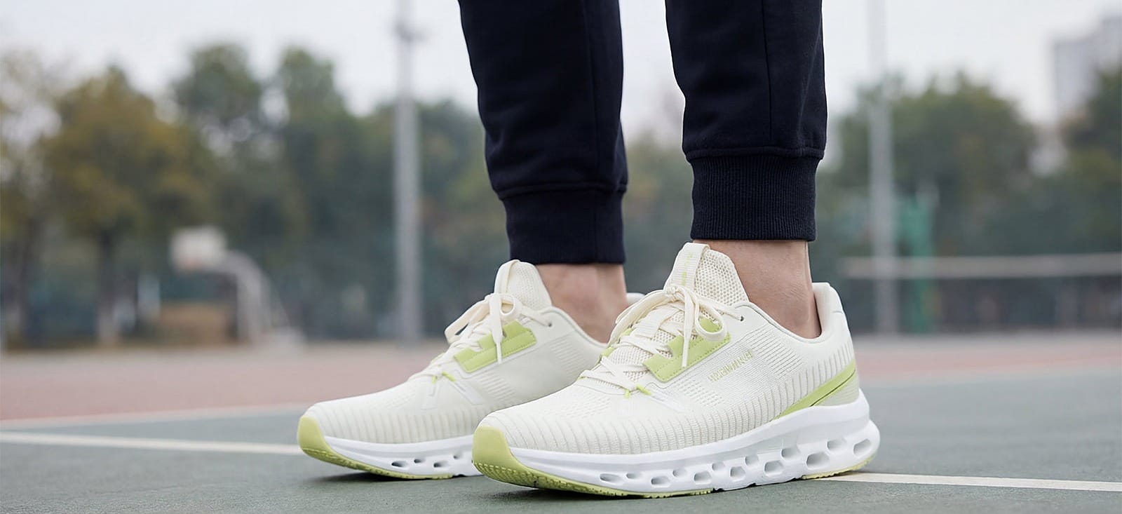 Neemans sneakers worn on court in the brand's own campaign photography, heading a read of 591 discounted Neemans shoe prices during the Comfort Rush Deals sale in August 2026