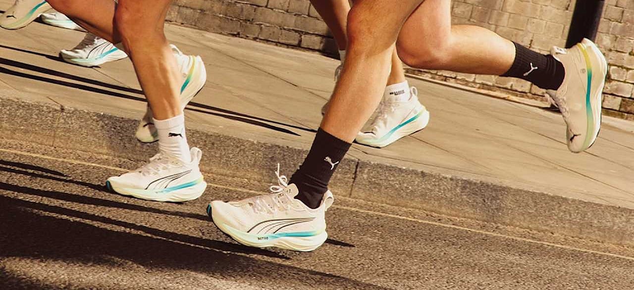 Runners on a street in PUMA NITRO running shoes, from PUMA's own running campaign photography - the sneaker category this page prices