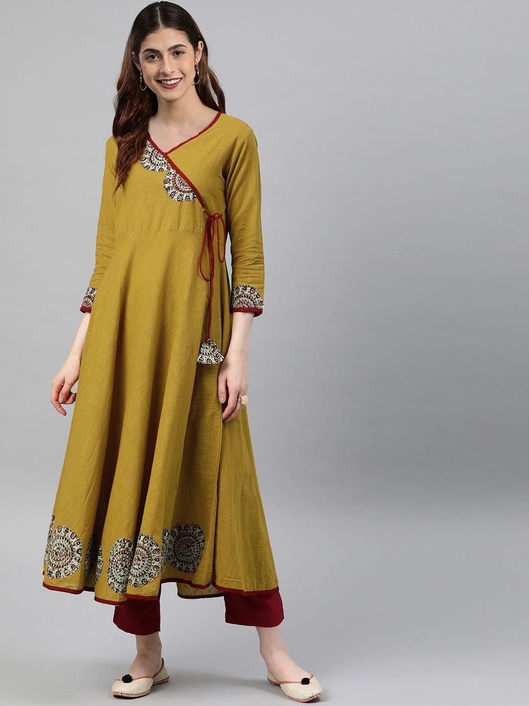 KALINI Women Mustard Yellow Floral Printed Angrakha Anarkali Kurta with Tassel Tie-Up Myntra sale