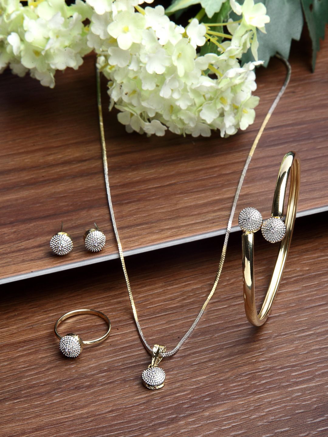 ZENEME Gold Plated American Diamond Studded pendant earring Bracelet with ring Set Myntra sale